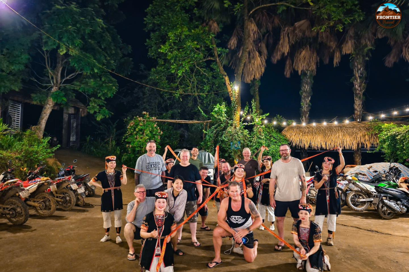 Tourists engaging in traditional craft activities with local ethnic groups in Ha Giang’s hig