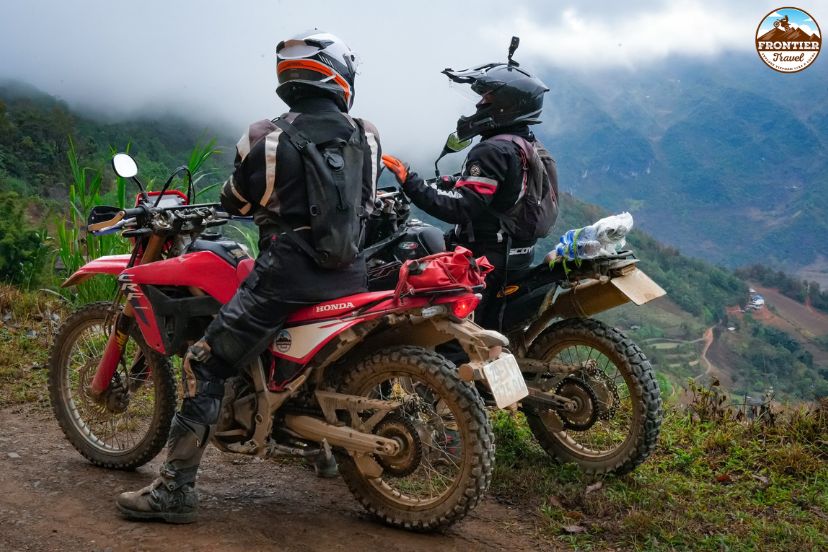 Motorbike rider leaning through a mountain curve