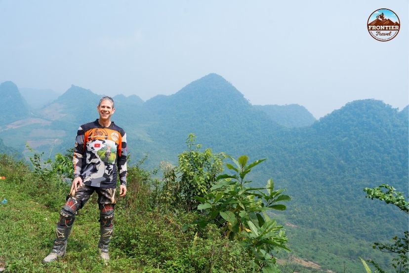 Capturing breathtaking cliffside vistas on a Ha Giang Loop easy rider scenic tour.