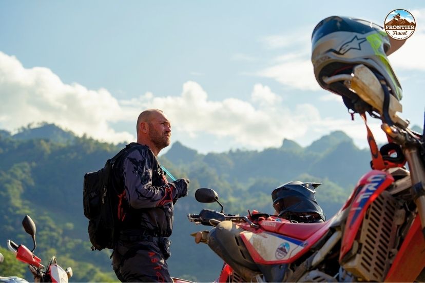 Motorists enjoying a deep on the scenic Du Gia Ha Giang motorbike loop detour.