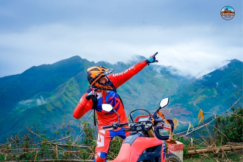 Navigating rocky jungle trails during 12 days North Vietnam motorbike tours.