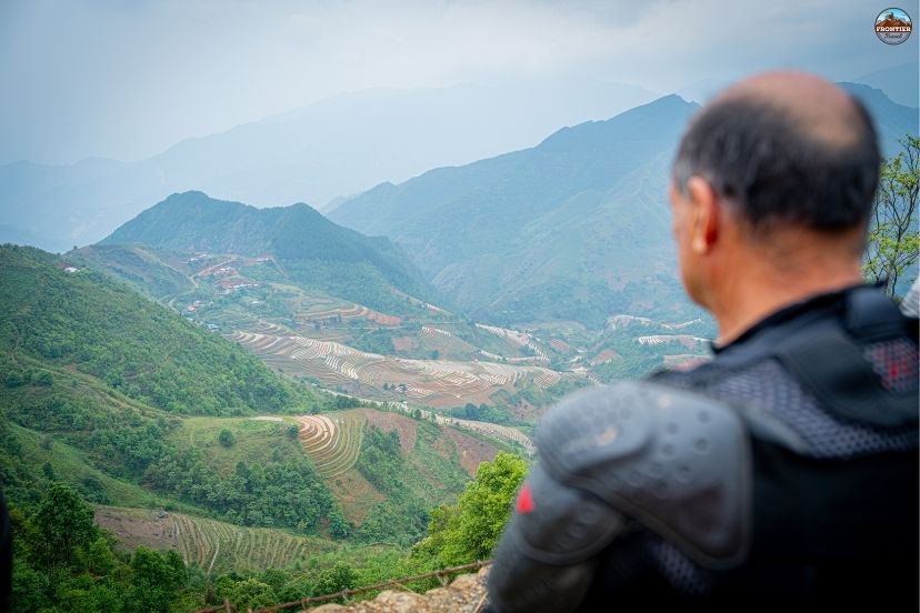 Navigating steep hillside hairpins during customized 8 days Vietnam motorbike tours.