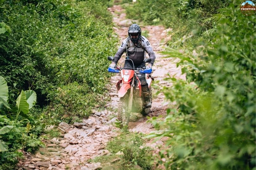 Passing historic border valleys and misty hills on a Vietnam motorbike tour