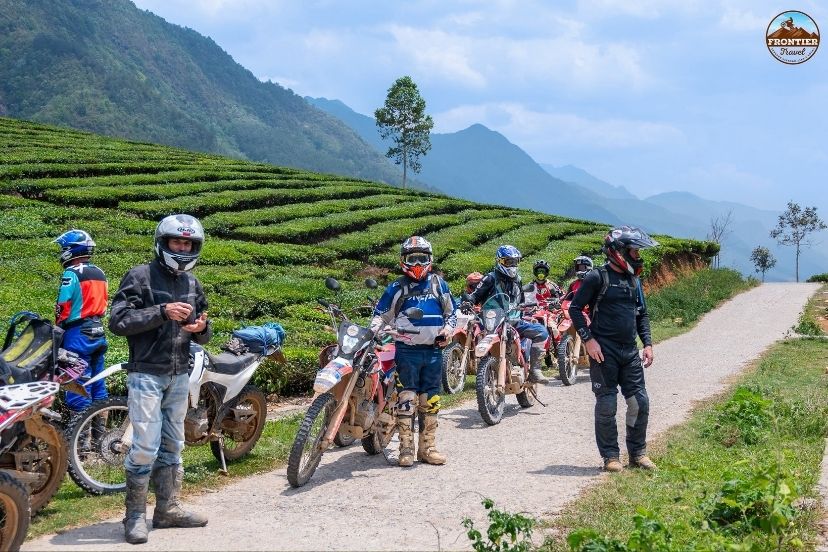Relaxing on the backseat with a Ha Giang Loop easy rider excursion.