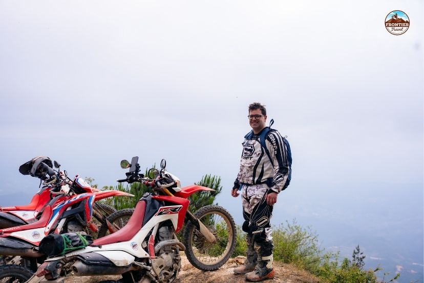 Verifying dual-sport bike readiness before starting the remote loop.