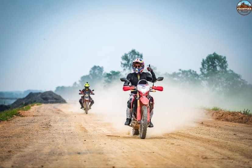 Warming up on flat roads with a Saigon to Hanoi motorbike tours adventure bike.