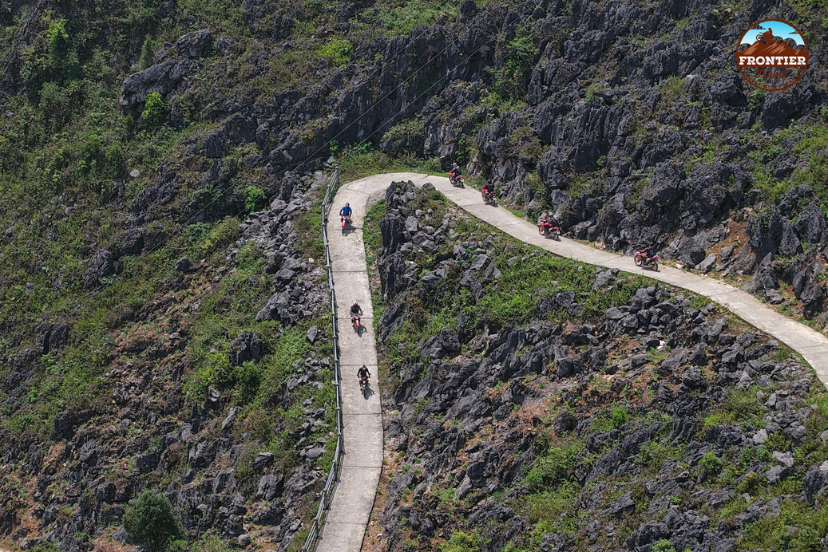 Breathtaking coastal scenery surrounds riders crossing the iconic Hai Van Pass.