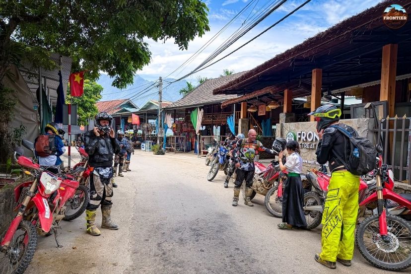 Checking rental contracts and vehicle condition before a Vietnam motorbike tour