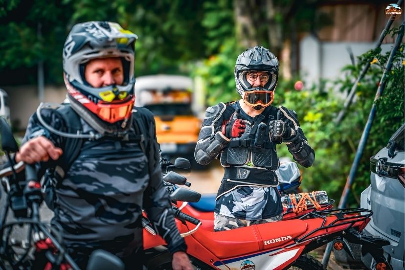 Rider reviewing a rental agreement before starting a Vietnam motorbike journey