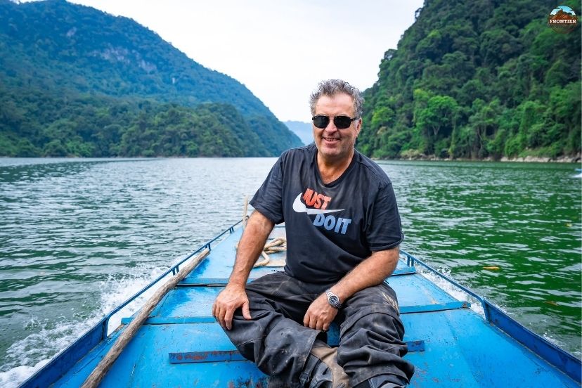 Scenic boat cruise along the emerald waters of Nho Que River