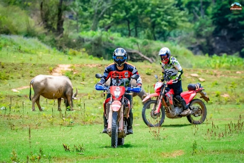 Motorbike riders exploring Ma Pi Leng Pass before the Nho Que River boat trip