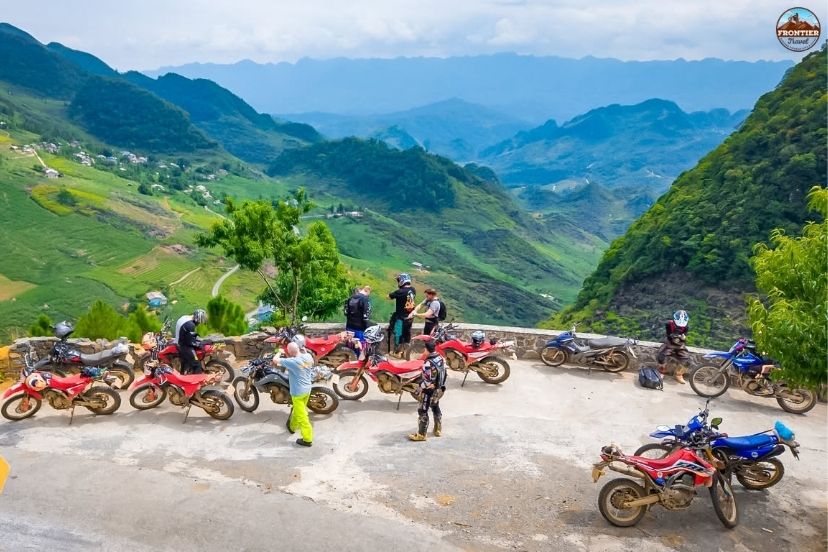 Motorbike riders following a scenic Ha Giang itinerary through mountain villages