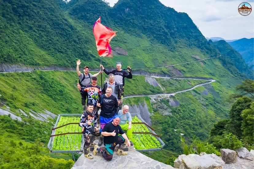 Riders preparing helmets and safety gear before the Ha Giang Loop