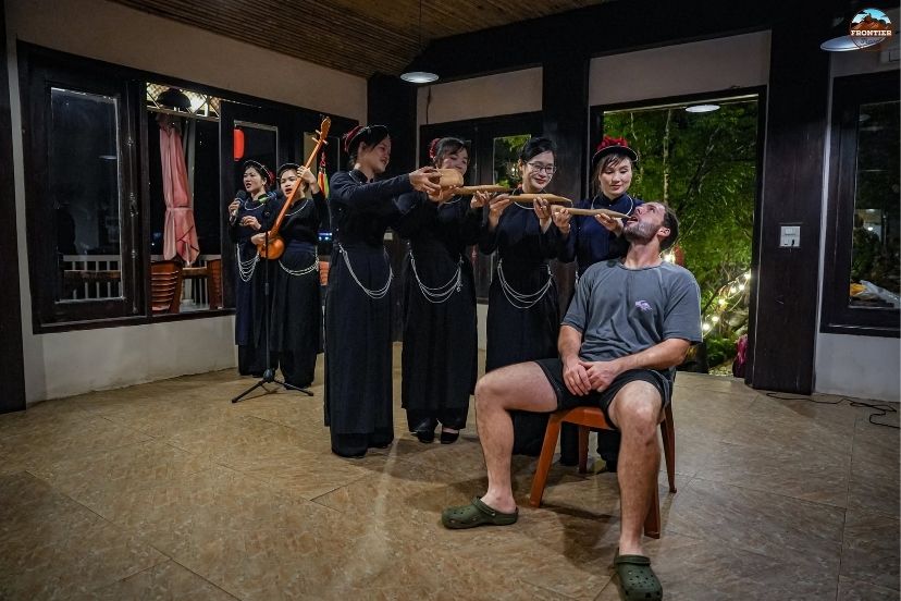 Travelers experiencing local homestay culture in Ha Giang ethnic villages